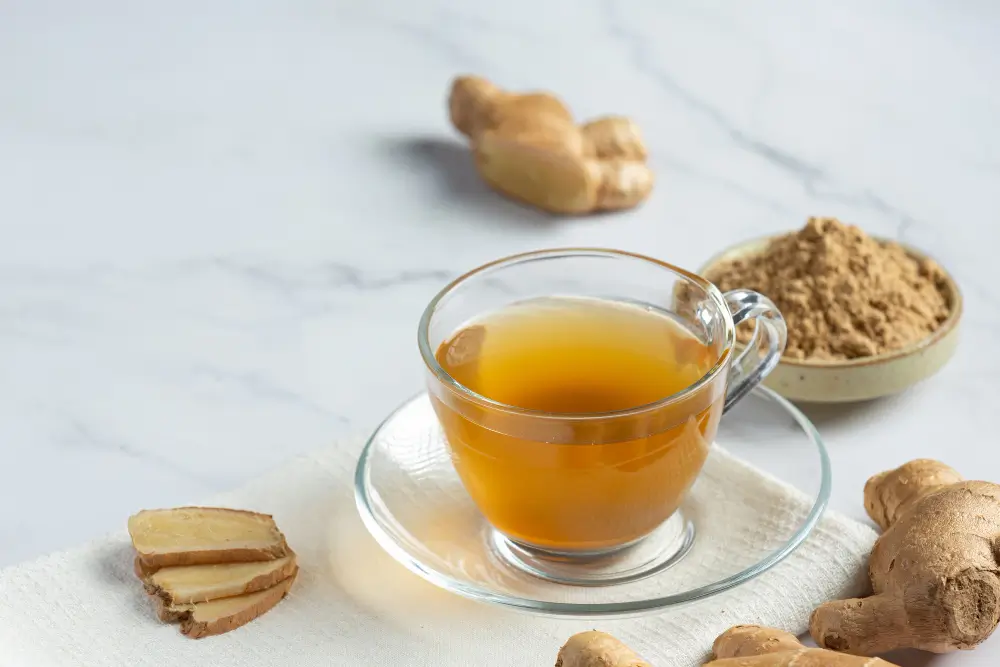 Fresh ginger root and lemon slices used to brew sore throat tea